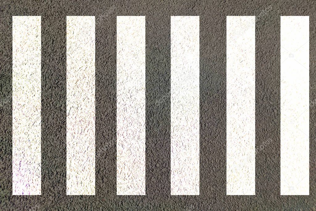 Zebra crossing made of stripes white and black lines painted on road for pedestrians crossing on busy traffic highways