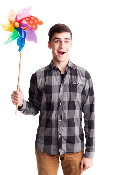 Homem feliz jogar com moinho de vento cor isolado — Fotografia de Stock