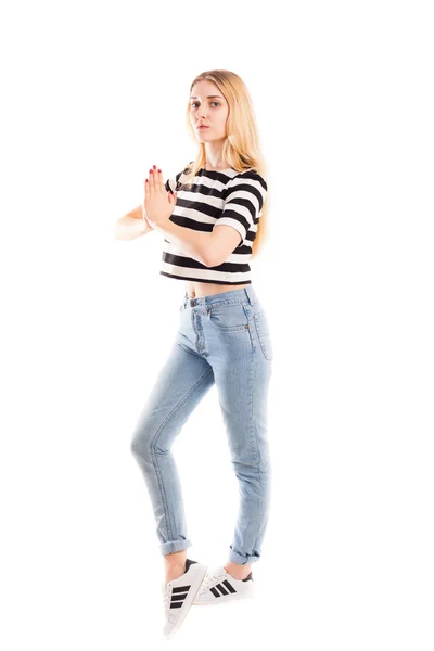 Mädchen in Jeans beten isoliert — Stockfoto