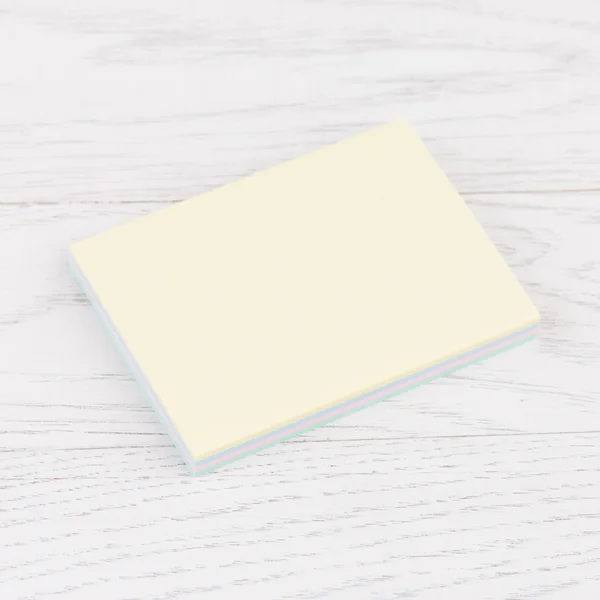 Pack of stickers note on wooden background — Stock Photo, Image