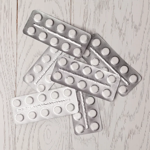 Pills in blister pack on table — Stock Photo, Image