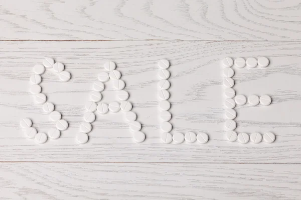 Word Sale made of pills on table — Stock Photo, Image