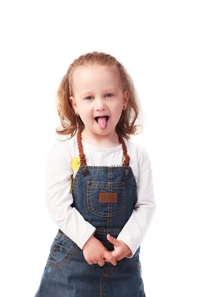 Linda niña mostrando la lengua aislada en blanco —  Fotos de Stock