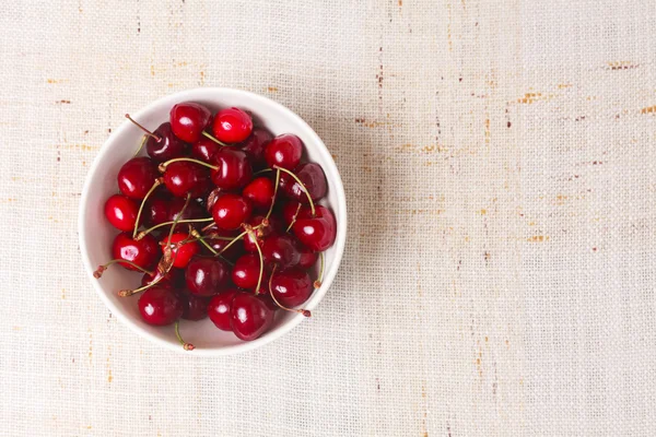 Fresh red cherries in bowl — Stock Photo, Image