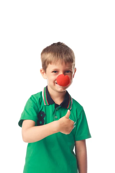 Niño con nariz de payaso aislado en blanco —  Fotos de Stock