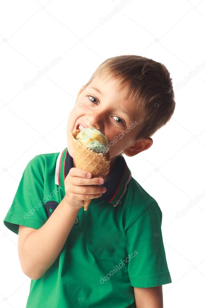 Little boy eating ice cream isolated on white