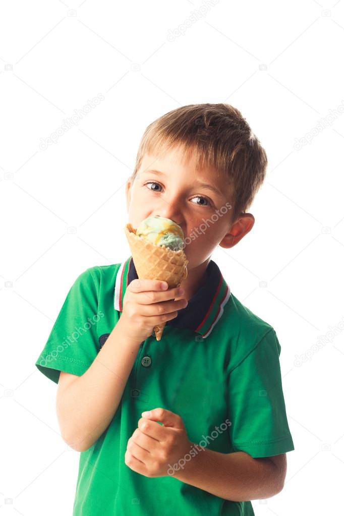 Little boy eating ice cream isolated on white