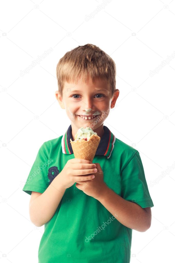 Little boy eating ice cream isolated on white