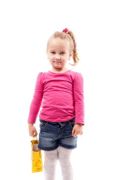 Little girl with shopping bag isolated on white — Stock Photo, Image