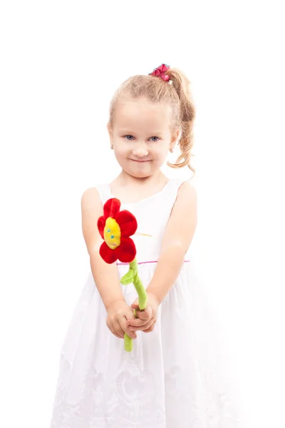 Linda niña con flor de juguete aislada —  Fotos de Stock