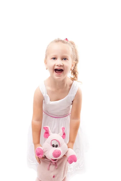 Cute little girl hold toy pig isolated — Stock Photo, Image