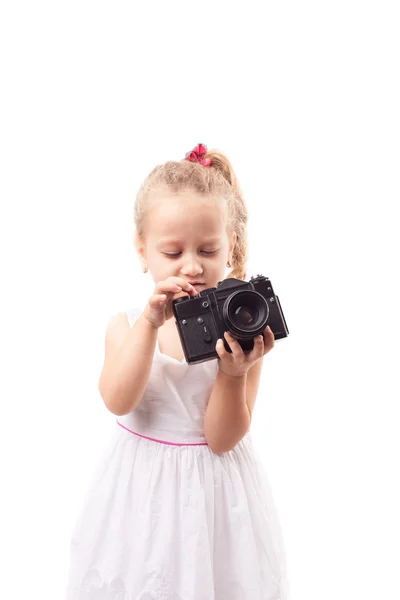 Cute little girl hold old film camera isolated — Stock Photo, Image