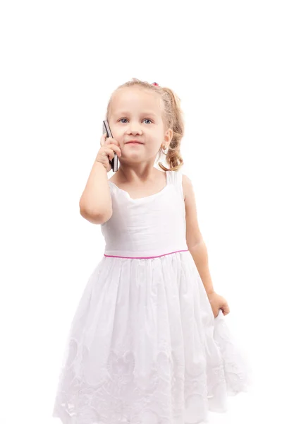 Cute little girl speak on phone isolated — Stock Photo, Image