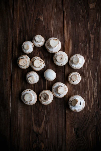 White mushrooms on wood table — Stock Photo, Image