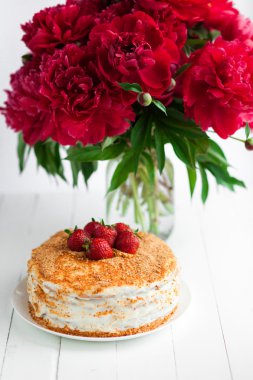 Strawberry cake on table, still life