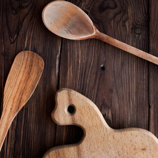Old wood spoon on table, square — Stock Photo, Image