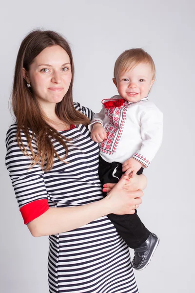 Mother and son in studio background — Stock Photo, Image