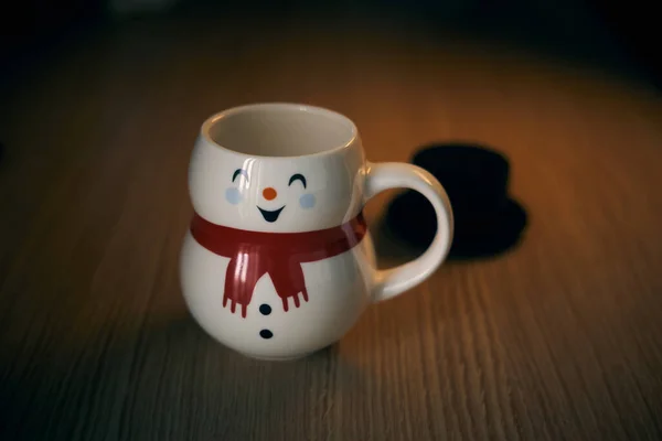 Snowman Shaped Mug Red Scarf Black Hat Wooden Table Smiling — Stock Photo, Image