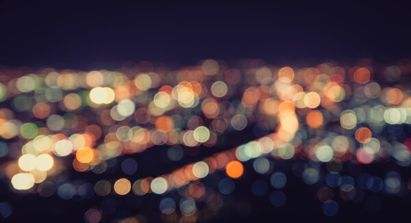 Blurred focus of big city in night time , cityscape