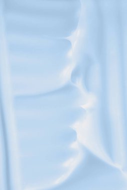 Mavi cilt kremi. Yakından çek. El kremi geçmişi, yüz kremi vakfı. Vücut losyonu dokusu, yüz kremi lekesi, şampuan köpüğü, nemlendirici temizleyici.