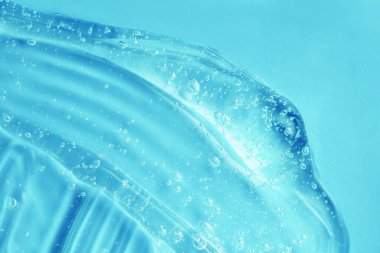 El dezenfektanı desenli baloncuk lekesi. Mavi nemlendirici, saç jölesi örneği. Şeffaf güzellik kozmetik serumu ürünü. Cilt makyajı kremi. Cilt bakımı temiz sıvı