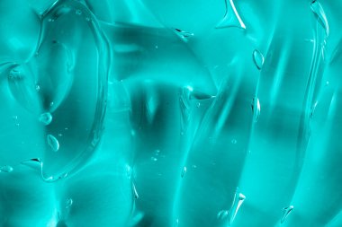 Soyut kozmetik arka plan. Kabarcıklı mavi jel deseni. Şeffaf güzellik serumu kozmetik ürünü. Cilt makyajı temizleyici leke örneği. Nemlendirici krem, saç jölesi. Makro
