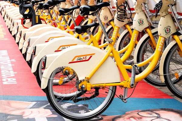 Rental service, public transportation concept. Street share bicycles or e-bikes for rent with electronic form of payment. Milan, Italy - October, 2019 — Foto de Stock