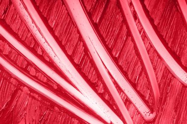 Makyaj kremsi fon. Sıvı güzellik kremi yakın çekim. Kırmızı ruj lekesi örnek dokusu arkaplanı.