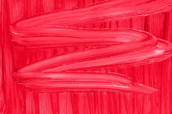 Make-up cremige Kulisse. Flüssige Schönheitscreme aus nächster Nähe. Roter Lippenstift wischt Muster Textur Hintergrund. — Stockfoto