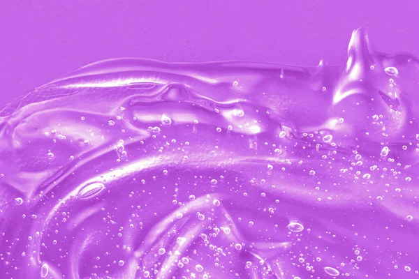 Gel serum vloeibare textuur, crème met collageen en retinol, shampoo monster. Cosmetisch voor huidverzorging. Antibacteriële desinfecteer vlekken. Lilac ontsmettingsstaal met belletjes. — Stockfoto
