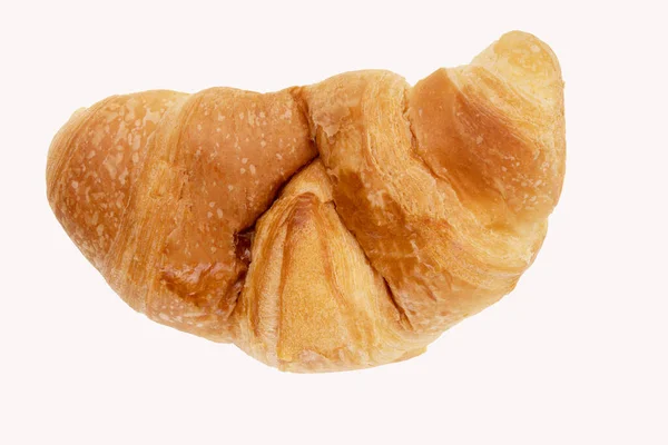 Delicious, fresh croissant on a white background from above. Croissant isolated. — Stock Photo, Image
