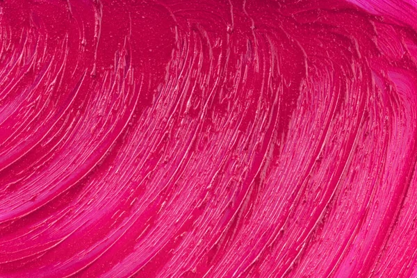 Purple cosmetics smear pattern. Beauty product sample closeup. Liquid lipstick cosmetic. Pink swatch matt backdrop