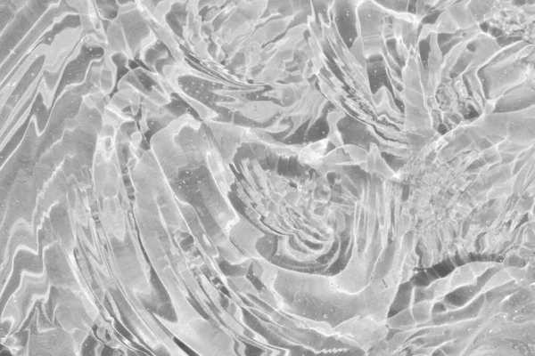 Kolajen ve retinolle cilt bakımı için Hyaluron asidi. Cilt losyonu yüz serumu örneği. Jel lekesi soyut dalga arkaplanı. Kozmetik krem şeffaf sıvı jel