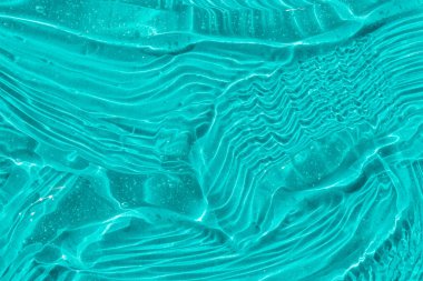 .Kabarcıklı mavi kozmetik jel dokusu. Şeffaf cilt kremi, yüz serumu, nemlendirici arka plan. Sıvı şeffaf cilt bakım ürünü örneği. Güzel hyaluronik asit