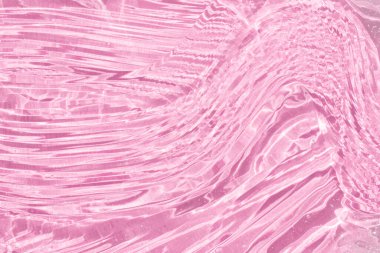 Güzel hyaluronik asit yayılmış. Kozmetik jöle serumu dokusu. Temiz kolajen jel, nemlendirici fon. Pembe sıvı şeffaf cilt bakım ürünü örneği. Emülsiyon