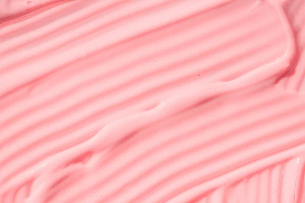 .Romige roze huidverzorging mousse product close-up. Perzik crème, vochtinbrengende crème spread, zonnebrandcrème cosmetische smeerolie achtergrond. Hydraterende beauty creme, balsem staal, roze verf, yoghurt textuur — Stockfoto