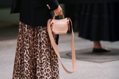 Paris, France - October, 06, 2025: woman wears Musebi mini tote pink bag. Fashion outfit handbag details, street style look accessory