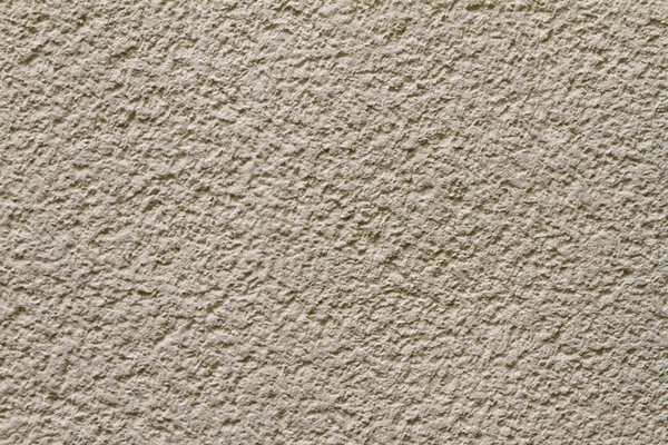 Closeup of bright-yellow plaster wall — Stock Photo, Image