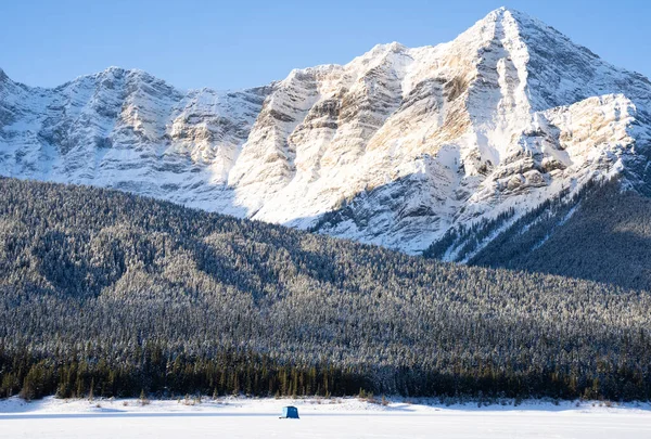 Distant Ice Fishing Tent Sits Frozen Mountain Lake Canadian Rocky — Stock Photo, Image