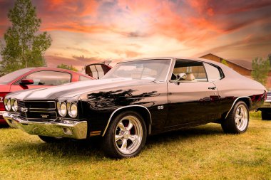 Airdrie Alberta Canada, August 07 2021: A Chevrolet Chevelle SS on display at a classic car show in a Canadian City under a dramatic sky.