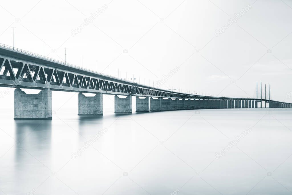 Long bridge over a river on a cloudy day