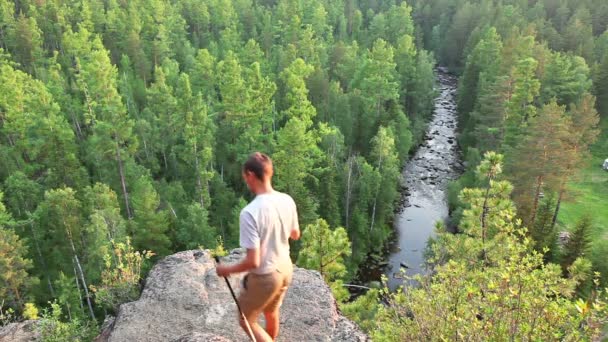 Hiker man standing on top of a mountain — Stock Video