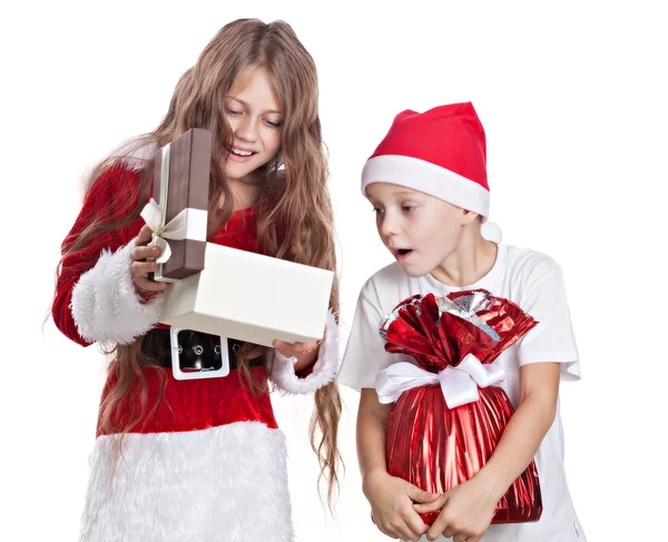 Christmas boy and girl with gifts. — Stock Photo, Image