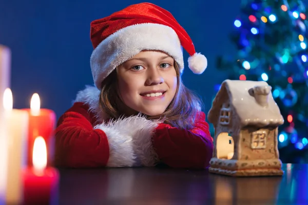 Girl girl in Santa hat. — Stock Photo, Image