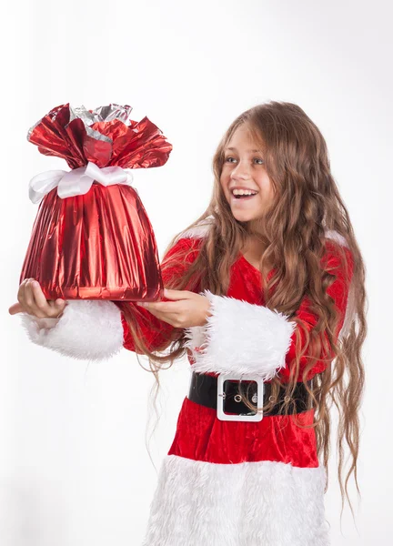 Christmas girl holds gift. — Stock Photo, Image