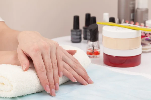 Hand on hand in nail salon — Stock Photo, Image
