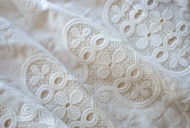Ivory colored lace close-up background, vintage or wedding style