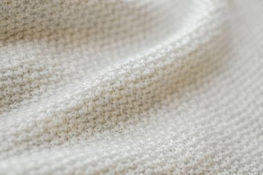 White natural texture of knitted wool textile background, cotton fabric close-up