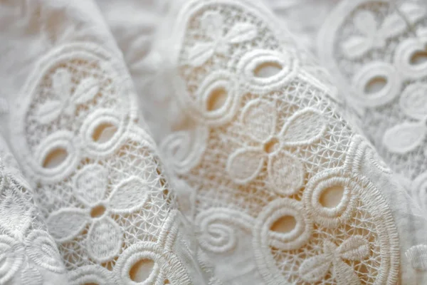 Ivory colored lace close-up background, vintage or wedding style