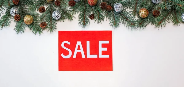 Special offer, new year's sale, discounts, beautiful discount banner with tree branches, Christmas decorations and gifts